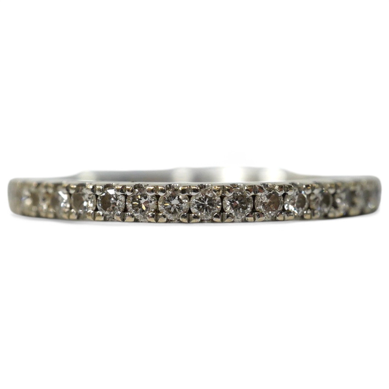 A modern Vera Wang 18ct white gold and diamond chip set half eternity ring, size K, gross weight 2.6 grams. Condition - good